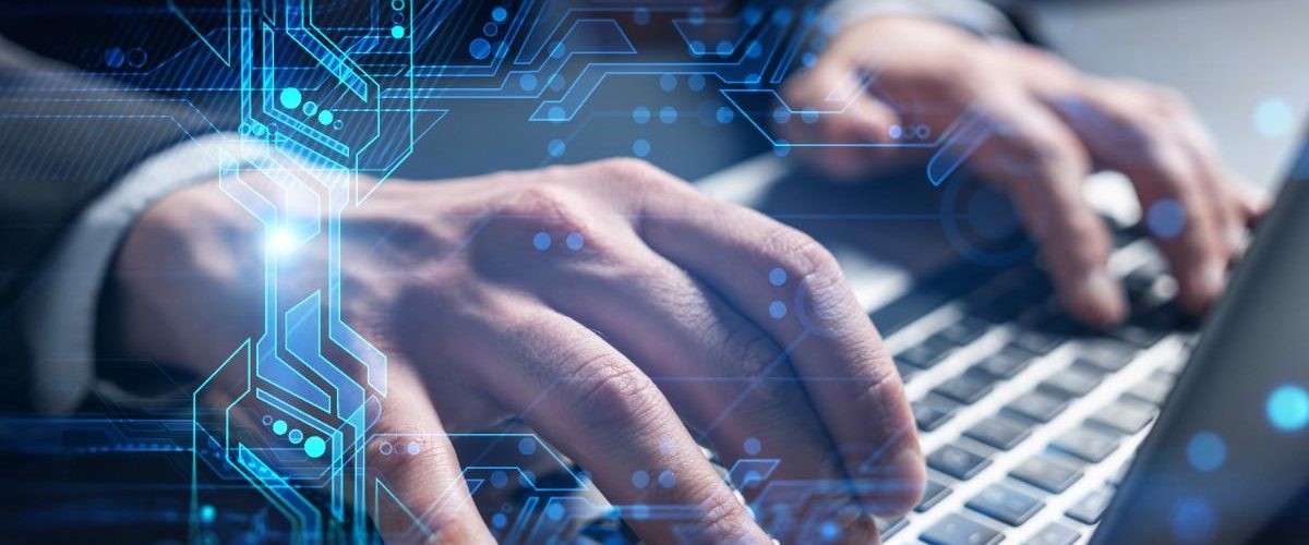 businessman-takes-notes-typing-laptop-background-technology-hologram (1)